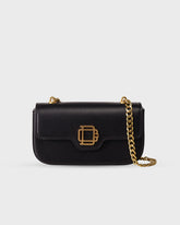 Bolso Iconic Bag No.1 en cuero vegano negro con cadena dorada y logo grabado, diseño versátil y elegante de Di Conza