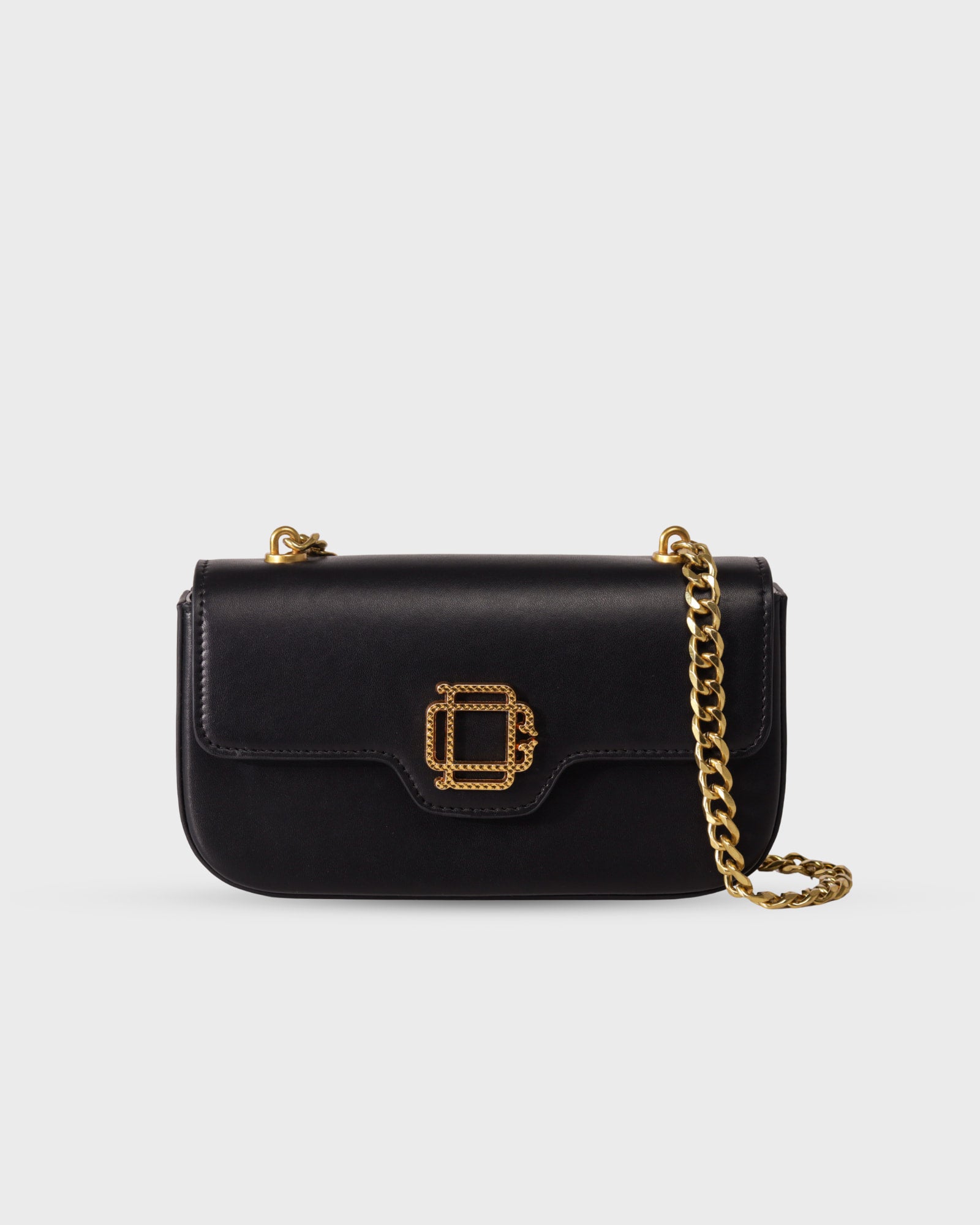 Bolso Iconic Bag No.1 en cuero vegano negro con cadena dorada y logo grabado, diseño versátil y elegante de Di Conza