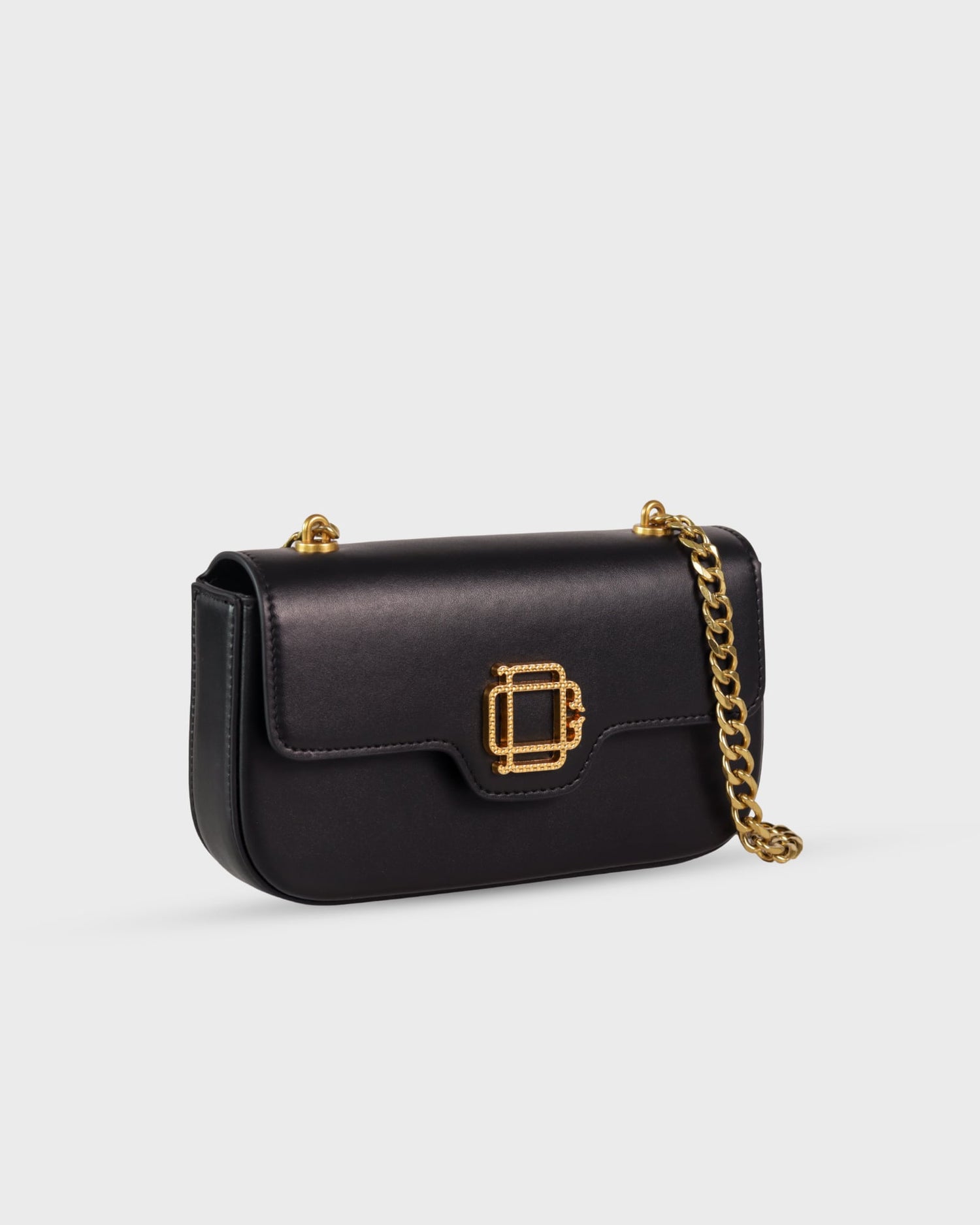 Bolso Iconic Bag No.1 en cuero vegano negro con cadena dorada y logo grabado, diseño versátil y elegante de Di Conza